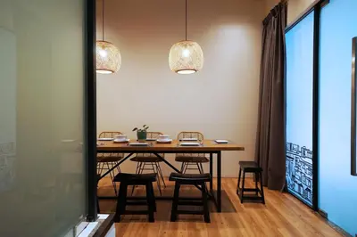 a dining room with a table and chairs at Chaos Boutique Hotel Kuala Lumpur in Kuala Lumpur