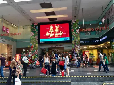 a group of people walking in a shopping mall at Chaos Boutique Hotel Kuala Lumpur in Kuala Lumpur