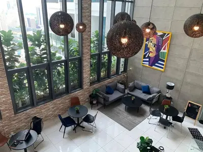 an overhead view of a lobby with tables and chairs at Maxhome Retreat at The Luxe in Kuala Lumpur
