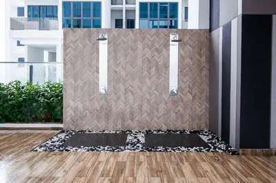 a room with a wall with a black and white rug at Maxhome Retreat at The Luxe in Kuala Lumpur