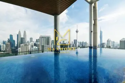 a swimming pool on the roof of a building with a city skyline at Maxhome Elite at The Luxe in Kuala Lumpur