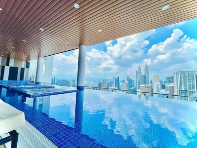 a swimming pool with a view of the city at Maxhome Elite at The Luxe in Kuala Lumpur
