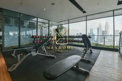a gym with a view of the city at Maxhome Elite at The Luxe in Kuala Lumpur