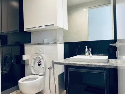 a bathroom with a toilet and a sink at Platinum Suites KLCC By Premium Hospitality in Kuala Lumpur