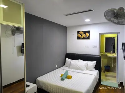 a bedroom with a bed with a stuffed animal on it at 08-3 Sweet Home-Casa Residency 3R 2B City View in Kuala Lumpur