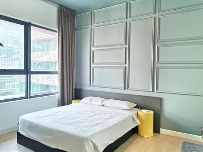 a bedroom with a bed with white sheets and windows at Arte Plus Ampang 2BR Private Lift Suite - Living Signature in Kuala Lumpur