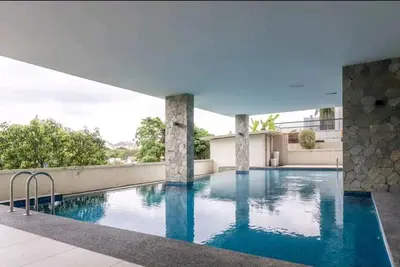 a swimming pool on the roof of a building at B3A l KLCC TRX Contemporaryl 17 Pax in Kuala Lumpur