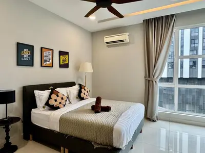 a bedroom with a large bed and a window at B3A l KLCC TRX Contemporaryl 17 Pax in Kuala Lumpur