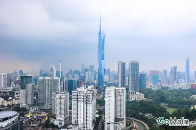 a view of a city with a tall skyscraper at 24H Check in & Skypool - Riveria City Premium KL Suite in Kuala Lumpur