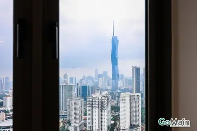 a view of a city skyline from a window at 24H Check in & Skypool - Riveria City Premium KL Suite in Kuala Lumpur