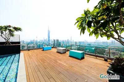 a balcony with blue and white benches on a building at 24H Check in & Skypool - Riveria City Premium KL Suite in Kuala Lumpur