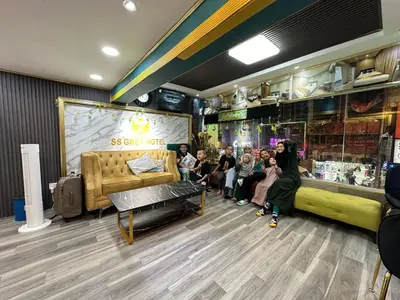 a group of children sitting in a room with a store at SS Grey Hotel kL in Kuala Lumpur