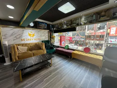 a room with a couch and a store window at SS Grey Hotel kL in Kuala Lumpur
