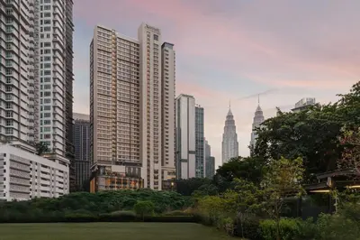 a city skyline with tall buildings and a park at Marriott Executive Apartments Kuala Lumpur in Kuala Lumpur