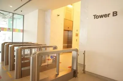 a lobby with a group of tables in a building at Summer Suite KL City Balcony Room KL Tower View in Kuala Lumpur