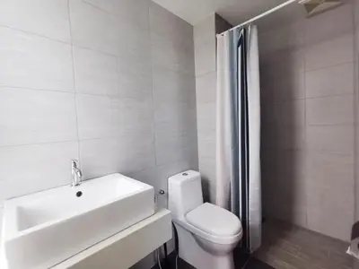 a white bathroom with a sink and a toilet at Arte Plus Ampang 2BR Family Suite - Living Signature in Kuala Lumpur