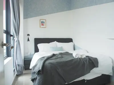 a bedroom with a large bed with white sheets and pillows at Arte Plus Ampang 2BR Family Suite - Living Signature in Kuala Lumpur