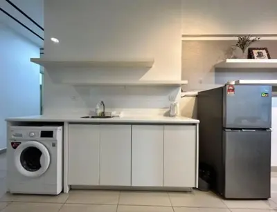 a kitchen with a sink and a washing machine at Arte Plus Ampang 2BR Family Suite - Living Signature in Kuala Lumpur