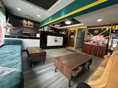 a living room with a couch and a tv at SS Grey Hotel BB in Kuala Lumpur