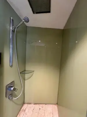 a shower in a bathroom with a glass door at Vortex Galaxy Suites KL in Kuala Lumpur