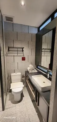 a bathroom with a toilet and a sink at Scarletz Suite By Skyscraper in Kuala Lumpur
