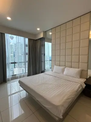 a bedroom with a large bed with a large window at Robertson Special Suites By Luna in Kuala Lumpur