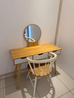 a dressing table with a mirror and a chair at Robertson Special Suites By Luna in Kuala Lumpur