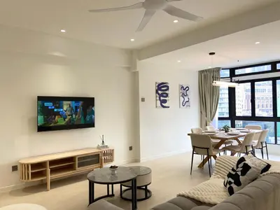 a living room with a couch and a table at Fahrenheit88 Opposite Pavilion KL Bukit Bintang in Kuala Lumpur