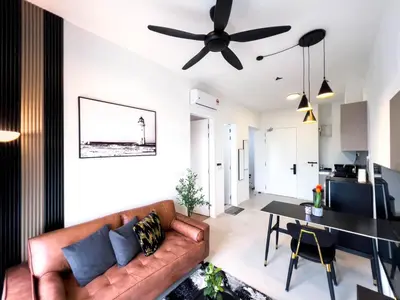 a living room with a couch and a table at Premier Stay KL - Bangsar South - King Bed - Work Space - Near LRT, VE, Conexxion in Kuala Lumpur