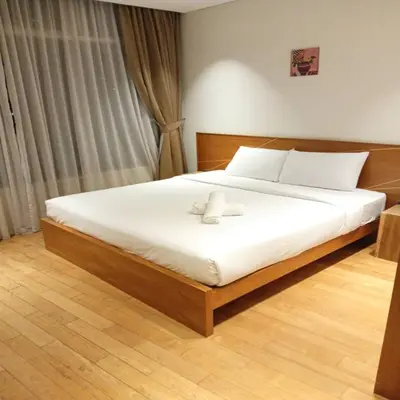 a bedroom with a large bed with white sheets at Vortex klcc by Elham in Kuala Lumpur