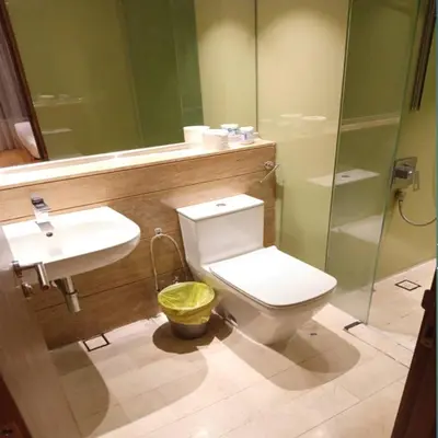 a bathroom with a toilet and a sink and a shower at Vortex klcc by Elham in Kuala Lumpur