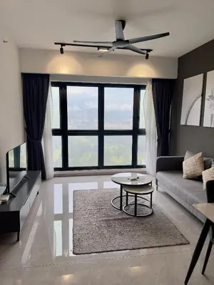 a living room with a couch and a table at Agile Bukit Bintang By Comfort Suites in Kuala Lumpur