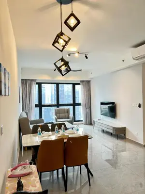 a living room with a table and a couch at Agile Bukit Bintang By Comfort Suites in Kuala Lumpur