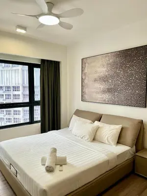 a bedroom with a large bed with a large window at Agile Bukit Bintang By Comfort Suites in Kuala Lumpur