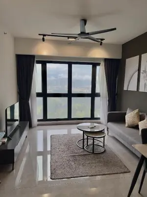 a living room with a couch and a table at Agile Bukit Bintang By Comfort Suites in Kuala Lumpur