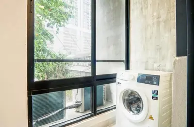 a washing machine in a room with a window at 68 Palms 04 l Midvalley l 6 Pax in Kuala Lumpur