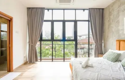 a bedroom with a bed and a large window at 68 Palms 04 l Midvalley l 6 Pax in Kuala Lumpur