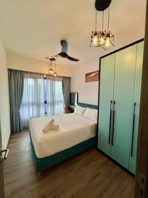 a bedroom with a large bed and a ceiling fan at Agile Bukit Bintang By Well Shaped in Kuala Lumpur