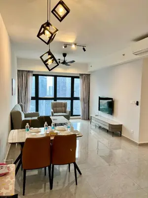 a living room with a table and a couch at Agile Bukit Bintang By Well Shaped in Kuala Lumpur