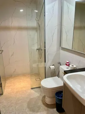a bathroom with a shower and a toilet and a sink at Agile Bukit Bintang By Well Shaped in Kuala Lumpur