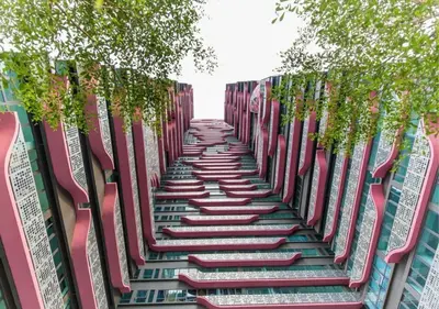 a garden with trees on the side of a building at Arte Plus Ampang Studio near KLCC - Living Signature in Kuala Lumpur