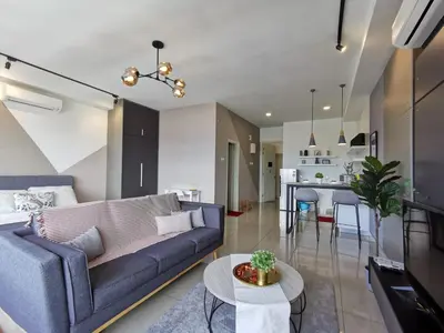 a living room with a couch and a table at Arte Plus Ampang Studio near KLCC - Living Signature in Kuala Lumpur