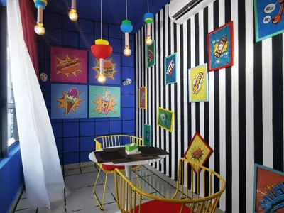 a room with a blue and white wall with a table and chairs at Arte Plus Ampang Studio near KLCC - Living Signature in Kuala Lumpur