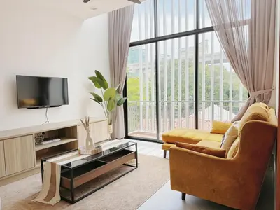 a living room with a couch and a tv at 68 Palms 03 l Midvalley l KL Sentral in Kuala Lumpur