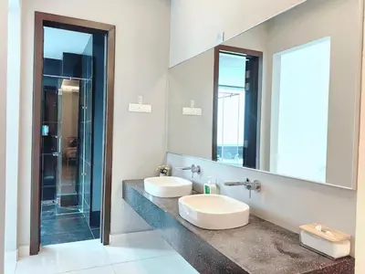a bathroom with two sinks and a large mirror at A3A l Near KLCC TRX l Santorini l 18 Guests in Kuala Lumpur