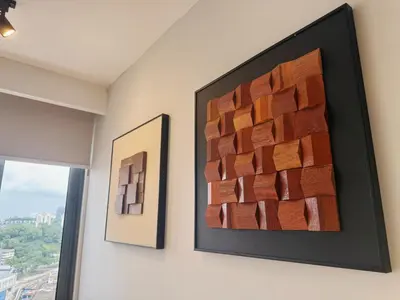 two pieces of art on a wall next to a window at Cozy Studio l Riveria City l 1km to KL Sentral in Kuala Lumpur