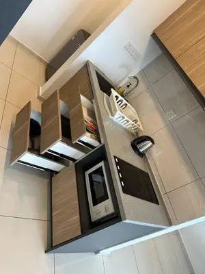 an overhead view of a kitchen with a tv and shoes at The Roberstson family suite with city views in Kuala Lumpur