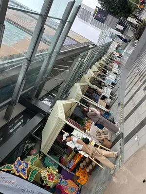 an overhead view of a store with people sitting at tables at The Roberstson family suite with city views in Kuala Lumpur