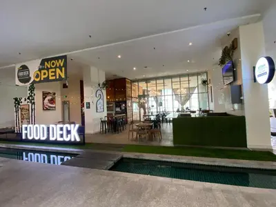 a food depot with a food clerk sign in a building at Infinity Sky pool hostel best in Kuala Lumpur