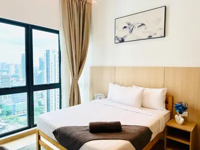 a bedroom with a bed and a large window at The Luxe & Colony KLCC By Comfort Dwellings in Kuala Lumpur